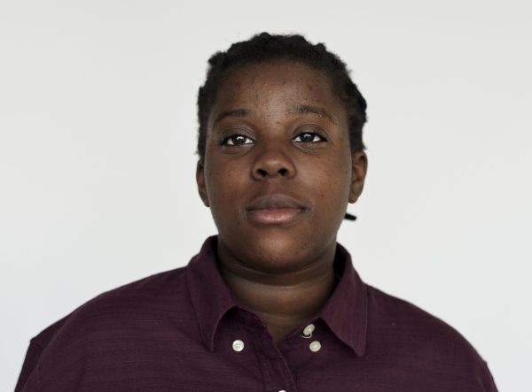 Portrait of a young African woman with braided hair