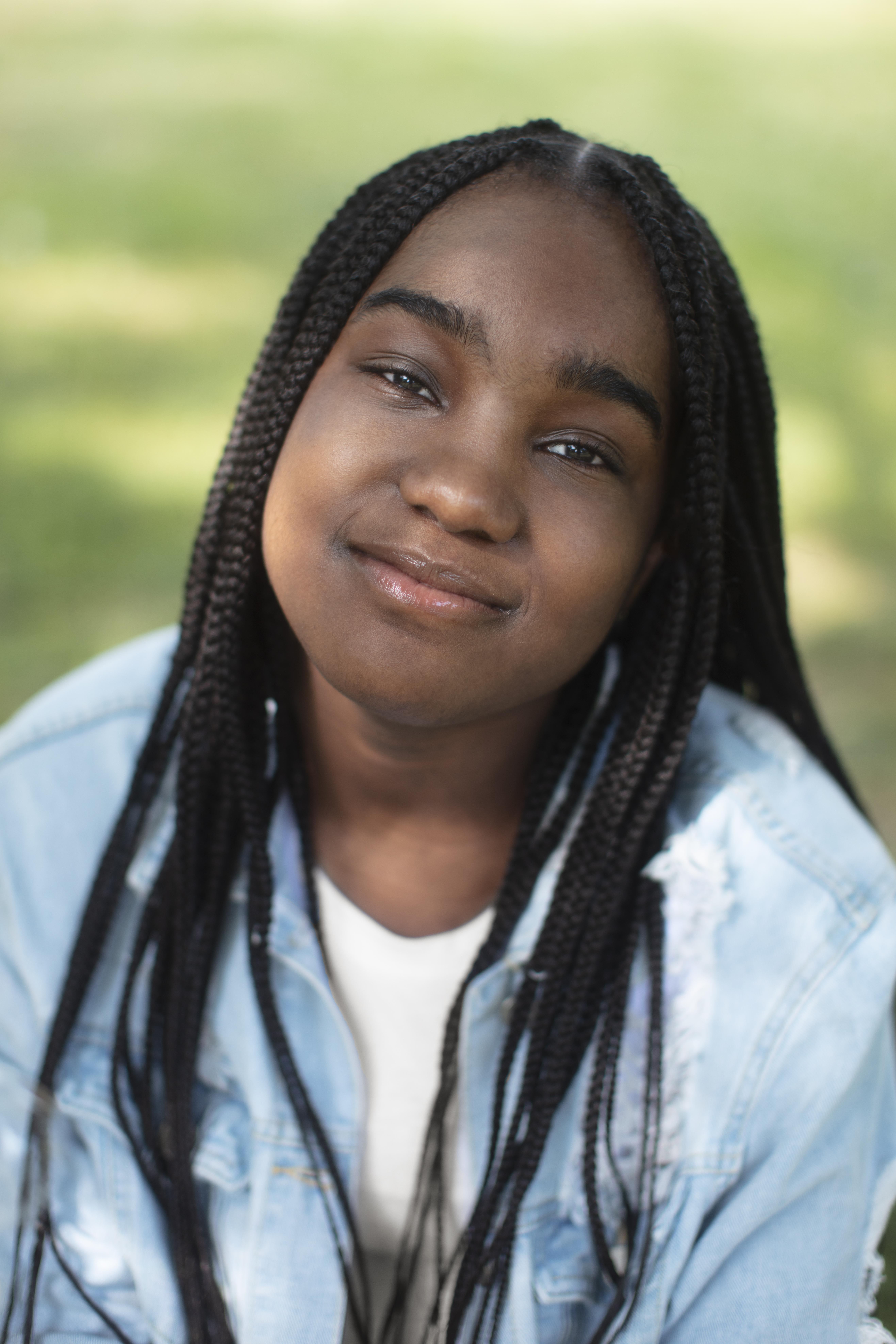 Smiling teenage girl relaxing outdoors