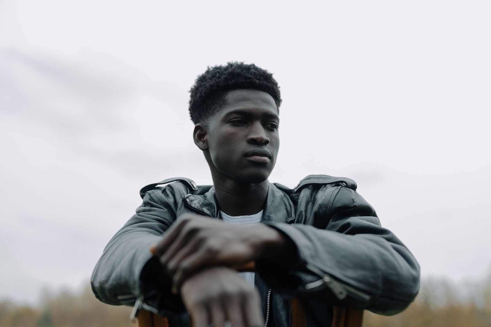 Young man sitting quietly, deep in thought